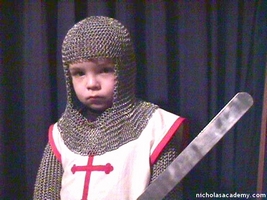 Alex in maille armor with sword and tabard